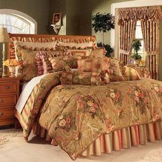 a bed room with a neatly made bed and curtains on the window sills