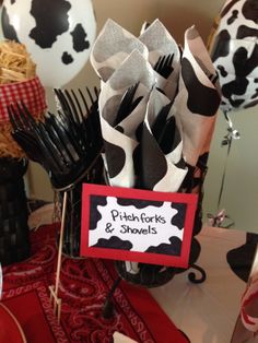 a table topped with lots of black and white decorations