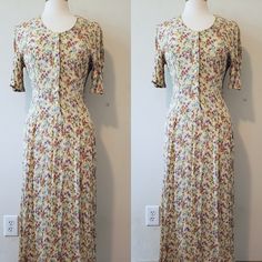 Beautiful vintage yellow/multi-colour flower-patterned short-sleeved maxi dress with button-up front. It looks like a mix of cotton and viscose, stretchy fabric. No visible stains or other defects. Size not written, but looks like EU/US S/M. Please read over the dress measurements carefully, to make sure the fit is okay for you, as I'm unable to accept returns/exchanges at the moment. Measurements are taken while garment is laid flat so please double the pit to pit and waist measurement. MEASUREMENTS (inches): Length 49" Pit to pit 17" Waist 14" For reference, mannequin measurements are: Size 6/8 Bust 36.5" Waist 25" Hip 37 Full-length Floral Print Spring Dresses, Vintage Short Sleeve Maxi Dress For Summer, Spring Floral Print Full-length Dress, Vintage Summer Maxi Dress With Short Sleeves, Spring Floral Print Full Length Dress, Modest Full-length Maxi Dress For Spring, Modest Full Length Maxi Dress For Spring, Spring Floral Print Full-length Maxi Dress, Retro Spring Maxi Dress For Daywear