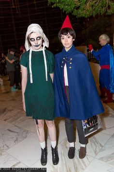 two people in costumes standing next to each other