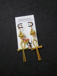 "Beautiful handmade  earrings made with a high quality gold plated metal Ankh symbol. Lightweight and easy to wear, these dangle earrings are 4\" long. Please come back and visit to check for more unique new designs and styles For more styles visit my Etsy shop:www.etsy.com/shop/SoftlySisterDesigns" Handmade Symbolic Ankh Earrings, Symbolic Gold Nickel-free Earrings, Handmade Spiritual Gold Plug Earrings, Gold Spiritual Metal Earrings, Spiritual Gold Metal Earrings, Handmade Ankh Earrings As Gift, Gold Spiritual Drop Earrings, Ankh Shaped Metal Earrings For Gift, Ankh-shaped Metal Earrings For Gift