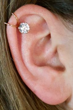 This extremely Sparkly CZ Ear Cuff (no piercing) hugs your upper ear and looks like a pierced cartilage. It features a VERY BIG and sparkly prong set 6mm Cubic Zirconia. It fits your high ear comfortably and securely.  Metals available:  •Gold Filled •Sterling Silver  Available in: Wedding Cartilage Earrings Internally Threaded, Upper Ear Piercing Ideas, Ear Piercing Helix, Fake Ear Piercings, Cartilage Ear Cuff, Gold Heart Stud Earrings, Faux Piercing, Ear Piercings Helix, Helix Ear