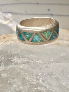 Turquoise ring Zuni wedding band size 4 sterling silver women Size 4 Weight  7.7g Width  1/4" Free Shipping & Free Postal Insurance  Delivered in a Gift Box  Free First Class shipping and postal insurance is included. If you want to upgrade to priority kindly pay an additional fee to do so.  This is recommended if you would like to have your package delivered faster than first class which has slowed down Turquoise Toe Ring Jewelry For Anniversary, Southwestern 925 Stamped Jewelry For Anniversary, Bohemian Inlay Jewelry For Anniversary, Turquoise Round Band Ring For Anniversary, Unique Stackable Turquoise Ring For Anniversary, Silver Stackable Turquoise Ring For Anniversary, Silver Southwestern Style Wedding Ring, Southwestern Style Silver Wedding Rings, Bohemian Hallmarked Turquoise Ring For Anniversary