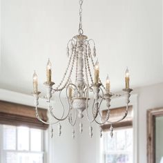 Lend striking visual appeal to your dining room or foyer with this chandelier. A durable wood frame ensures lasting quality, six lights surround the frame to emit glistening light throughout your space. Parrot Uncle 6-Light Distressed White French Country/Cottage WoodChandelier | BB8817-6110V French Country Chandelier With Crystals, Dinning Room Light Fixture French Country Dining Tables, French Country Chandelier Dining Room Lowe's, Country Crystal Chandelier, What Color Chandelier With White Farm Table, Farmhouse Chandelier Bedroom French Country, French Country Chandelier Over Island, French Country Chandelier Overstock, French Country Chandelier The Home Depot