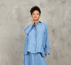 The Blue linen shirt women is our favorite weekender. Featuring an oversized relaxed fit, asymmetrical cut with front button closing and long sleeves. This White linen shirt women is finished with attached avant garde pockets on both side and open back. The long sleeve shirt is made from lightweight linen, that is versatile for any occasion! The Blue linen blouse women is designed to be comfortable and not troublesome to wear. After wearing this avant garde clothing - Blue long sleeve linen shir Spring Linen Tops With Pockets, Spring Linen Loungewear Blouse, Relaxed Fit Lounge Blouse With Pockets, Oversized Linen Blouse With Pockets, Long Sleeve Linen Tops For Daywear, Spring Linen Shirt With Relaxed Fit, Oversized Linen Long Sleeve Shirt, Long Sleeve Linen Blouse With Pockets, Oversized Linen Shirt For Work