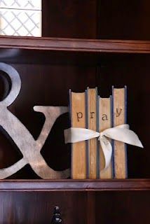 a book shelf with books and decorative letters