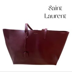 Saint Laurent Leather Tote Bag 100% Leather Burgundy Fall Collection Color Press Stud Closure Top Handles, Spacious Interior, Gold-Toned Lettering Width 37cm, Height 28cm, Depth 13cm Specialist Leather Clean Made In Italy Used A Couple Of Times, Excellent Condition, Includes Zippered Pouch Inside Business Burgundy Bags With Palladium Hardware, Designer Burgundy Shopping Bag, Designer Burgundy Bag For Shopping, Luxury Burgundy Bag For Everyday, Classic Burgundy Bag With Dust Bag, Classic Burgundy Bag With Dust Bag Included, Classic Burgundy Bag, Luxury Burgundy Tote Bag, Designer Burgundy Tote Bag