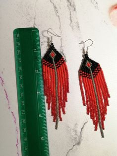 Unique red long earrings made of Czech beads Length 4.6 inches(12 cm) Width1.1 inch(3cm) Red Beaded Fringe Dangle Earrings, Red Beaded Fringe Drop Earrings, Red Beaded Tassel Drop Earrings, Traditional Red Jewelry With Fringe, Traditional Red Fringe Jewelry, Red Beaded Earrings With Tassels And Round Beads, Red Beaded Dangle Earrings With Tassels, Red Beaded Earrings With Tassels, Traditional Red Beaded Tassel Earrings