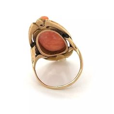 Material: 14k yellow gold  Measurement: 1.33" long x 0.60" wide x 0.26" high  Coral: 0.77" long x 0.38" wide  Ring Size: 6.5  Weight: 6.4 grams    This is a vintage long finger ring, crafted from 14k yellow gold with a polished finish. It has a carved cameo depicting a a woman and is accented with a 2 points bezel set diamond. The base platform has a fancy open design with slim shank and band. Wide Ring, Bezel Set Diamond, Wide Rings, Open Design, Finger Ring, Ring Finger, Bezel Setting, Ring Size, Coral