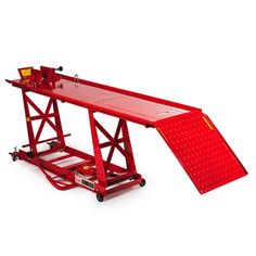 a large red table sitting on top of a dolly