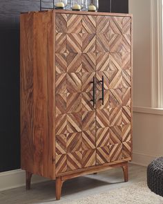 a wooden cabinet sitting in front of a window