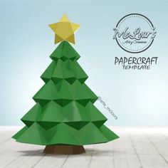 an origami christmas tree with a star on top and the words papercraft ultimate written below it