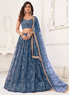 Elevate your style game with our light blue net lehenga choli! Perfect for women or girls, this readymade Indian wedding lehenga showcases exquisite craftsmanship and intricate details. Be the center of attention at any event with this stunning piece, ideal for bridesmaids, parties, receptions, and more! The unstitched blouse can be customized upto 46 inches. Do Note: All the accessories shown are for styling purpose only. Slight color variation may occur due to photographic reasons. Occasion : Grey Lehenga, Fancy Lehenga, Heavy Lehenga, Asian Dresses, Embroidery Butterfly, Bridesmaid Lehenga, Butterfly Net, Party Wear Lehenga Choli, Work Lehenga