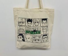 a tote bag with an image of the characters from hunter comics printed on it