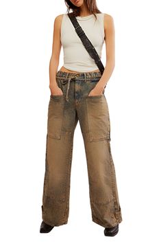 Chic fading and nonstretch denim give an authentic feel to these cargo jeans featuring plenty of pockets for your on-the-go essentials. 30 1/2" inseam; 27" leg opening; 12 1/2" front rise; 15" back rise (size Medium) Zip fly with button closure Five-pocket style 100% cotton Machine wash, dry flat Made in Turkey Wide Leg Cargo Jeans, Cargo Jeans, Wide Leg, Free People, Nordstrom, Size Medium