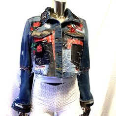 a mannequin wearing a jean jacket with patches on it's sleeves and sides