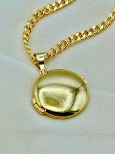 14k Gold Round locket Necklace, 24", with 3.7mm Curb Chain, 14.54 gr . Premium lobster clasp for added safety! Priced to sell! Compare our prices to other similar sellers! Arrives in a GIFT BOX and includes FREE SHIPPING within the USA and Canada. International shipping is available at the most economical rates on ETSY. I HAVE BEEN IN THE JEWELRY BUSINESS ALL MY LIFE. I am a second -generation family member making gold and jewelry. Please feel free to ask me any questions - Always happy to help! Curb Chain Jewelry With Round Pendant For Gift, Curb Chain Round Pendant Jewelry Gift, Gold Locket Necklace For Birthday, Round Pendant Curb Chain Jewelry Gift, Round Locket Jewelry For Birthday, Gold Locket Necklace For Birthday Gift, Personalized Gold Locket Necklace For Birthday, Round Tarnish Resistant Locket Necklace Gift, Round Locket Necklace For Birthday Gift