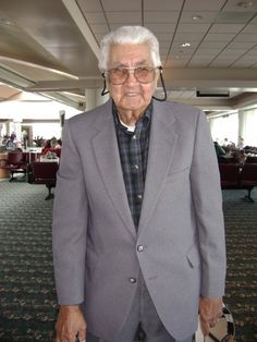 an older man in a suit and tie