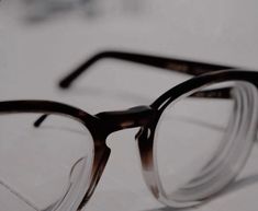 a pair of glasses sitting on top of a table