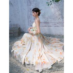 A strap dress depicting a goldfish swimming gently and flowers in full bloom. An elegant and elegant drape silhouette made with a generous amount of fabric. It makes your waistline look beautiful. Let yourself be invited to a fantasy world filled with soft light. 
 
 Size 
 
 S size
 
 Length: 110cm (*longest part) 
 Length: 100cm (*shortest part) 
 Bust: 84cm 
 Waist: 68cm 
 
 
 M size 
 
 
 Length: 113cm (*longest part) 
 Length: 103cm (*Shortest part) 
 Bust: 88cm 
 Waist: 72cm 
 
 L size Summer Floral Print Maxi Dress For Banquet, Chiffon Floral Print Dress For Banquet, Summer Wedding Guest Dress With Flowy Skirt, Elegant Apricot Dress With Spaghetti Straps, Spaghetti Strap Sundress For Weddings, Elegant Chiffon Floral Dress For Wedding, Elegant Chiffon Floral Wedding Dress, Summer Wedding Floral Dress, Ethereal Sleeveless Summer Dresses