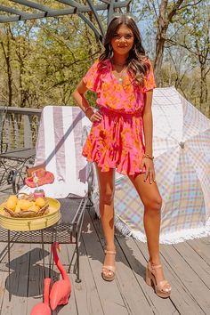 You are guaranteed to look sassy and sweet in this darling hot pink romper featuring lightweight material patterned with a pretty orange floral print, a faux wrap bodice with a v-cut neckline, short loose sleeves, a cinched elastic waistline with a tie closure, a keyhole accented upper back with a button closure, and a relaxed shorts silhouette that ends in straight upper-thigh length hemlines! on products Measurements XS : Bust 30", Hip 32", Inseam 2", Length 30", Sleeve Length 7", Waist 28". S : Bust 32", Hip 34", Inseam 2", Length 31", Sleeve Length 7", Waist 30". M : Bust 34", Hip 36", Inseam 2", Length 32", Sleeve Length 7.5", Waist 32". L : Bust 36", Hip 38", Inseam 2", Length 33", Sleeve Length 7.5", Waist 34". XL : Bust 38", Hip 40", Inseam 2.5", Length 34", Sleeve Length 8", Waist Hot Pink Romper, Pretty Orange, Orange Floral Print, Pink Romper, Loose Sleeves, Pink Rompers, Sweet Floral, Floral Romper, V Cut