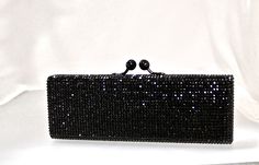 "Heart- stoppingly beautiful! These Rectangular Formal Evening Purses in Stunning Colors will be the talk of town!! Each takes a month to make, crystal by crystal, all done by hand! Each one is a brand new evening bag fully covered in genuine, very fine, small sized Swarovski Crystals from Austria! This exquisite minaudiere bag is fully crystallized in all sides with meticulous precision and spectacular detail. It is also lined in genuine leather. You can carry it in the palm of your hand as a c Chic Crystal Evening Bag For Weddings, Elegant Evening Bag With Crystal Bling, Elegant Clutch With Bling For Events, Elegant Crystal Evening Bag With Bling, Elegant Crystal Clutch With Bling, Elegant Event Clutch With Bling, Chic Crystal Evening Bag For Formal Occasions, Elegant Bling Clutch For Events, Elegant Evening Bag With Bling For Events