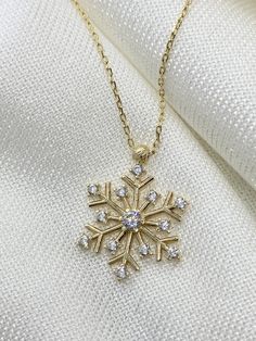 "ABOUT PRODUCT This 14K real gold Snow Flake with CZ Diamond is beautifully designed and hand crafted with our associates to make this a special gift for your loved ones. Knowing the value of our customers, We prepare each piece with extra care and attention.  ITEM DETAILS Material: 14K Gold Approx: 2.00 gram Diamond: Cubic Zirconia Available colors: Gold, Rose Gold, White Gold Available Sizes: 14\" to 20\" ✪ AAA Grade White Cubic Zirconia ✪ 14k Solid Gold ✪Available 14K White, Yellow, Rose Gold Pretty Jewelry Necklaces, Snow Flake, Pretty Jewelry, Necklace Minimalist, Christmas Theme, Cz Diamond, Pendant Design, Dainty Necklace, Pretty Jewellery