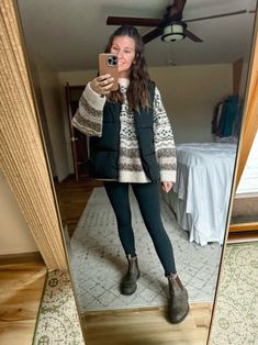 oversized cream sweater outfit ideas, fair isle print sweater style, cozy fall outfit inspiration, leggings and boots fall look, Blundstone boots casual fashion, black puffer vest outfit ideas, layered fall outfit Pinterest inspo, cozy sweater and leggings combo, rustic fall style with boots, cream fair isle sweater street style, casual autumn outfit with layers, warm winter outfit ideas, cozy layered look with puffer vest, fall adventure outfit style, leggings and boots outdoor outfit, cool vibes sweater Leggings And Blundstones, Cozy Leggings Outfit, Leggings Outfit Aesthetic, Black Puffer Vest Outfit, Vest Outfit Ideas, Cream Sweater Outfit, Warm Winter Outfit, Fall Outfits Pinterest, Birkenstock Boston Outfit