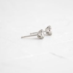 A pair of matching round brilliant cut diamonds in your choice of natural or lab-grown diamond. Please note: these earrings are listed with the total carat weight for both studs together. Each diamond is SI+ clarity, G+ color. Solid 14k gold posts and butterfly backings. Also available in platinum. Sold as a pair. We handcraft each piece with responsibly sourced metals and ethically sourced stones. Minimalist Brilliant Cut Diamond Earrings, Everyday White Gold Diamond Earrings With Single Diamond, Minimalist White Gold Diamond Earrings With Single Diamond, Minimalist Solitaire Cubic Zirconia Diamond Earrings, Minimalist Solitaire Diamond Earrings, Everyday White Diamond Earrings With Prong Setting, Minimalist Cubic Zirconia Solitaire Diamond Earrings, Minimalist White Diamond Earrings With Brilliant Cut, Diamond White Heart Cut Brilliant Earrings