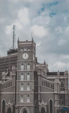 a large building with a clock on the front