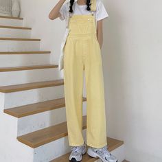 Light buttery yellow overalls with a high waist, relaxed straight leg fit. S: 33" waist, 43" hips, 12" rise, 25" thighs, 18.5" ankles, 23" inseamM: 34.5" waist, 44.5" hips, 12" rise, 25.5" thighs, 19" ankles, 23.5" inseamL: 36" waist, 46" hips, 12" rise, 26" thighs, 19.5" ankles, 24” inseamXL: 37.5" waist, 47.5" hips, 12" rise, 26.5" thighs, 20" ankles, 24.5" inseam How to attach buckles:Slide the rectangular buckle on first, followed by the T-shaped buckle. Overall straps will hold on its own a Pastel Overalls, Yellow Overalls, Spring Denim, Shoe Gifts, Pastel Yellow, Denim Overalls, Overall Dress, Sweater Blouse, Cardigan Jacket