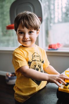 Unisex Sizing Mustard Yellow Coeur d'Alene Bear Design Casual Short Sleeve Shirt For Playtime, Relaxed Fit Crew Neck Top For Playtime, Short Sleeve Graphic Tee For Playtime, Casual Crew Neck Shirt For Playtime, Graphic Tee Shirt For Playtime With Short Sleeves, Graphic Tee Short Sleeve Shirt For Playtime, Casual Short Sleeve Tops For Playtime, Casual Yellow T-shirt For Playtime, Casual Yellow T-shirt For Play