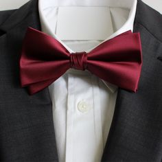 Classy and formal pre-tied and adjustable satin double-deck bow ties for your next formal event. Matches great with suits and tuxedos. Color: Sangria / Burgundy Material: Satin Polyester Adult Pre-Tied Bow Tie: approx. 4.75 inch width by 2.5 inch height Necksize 11.5 inches - 20 inches Metal clasp for secure and comfortable wear. Matching Pocket Square: approx. 9 inches by 9 inches www.tie-mood.com Elegant Solid Color Bow For Wedding, Elegant Red Suit And Tie Accessories For Groom, Solid Color Wedding Tie With Satin Bow, Solid Wedding Tie With Satin Bow, Wedding Suit And Tie Accessories With Satin Finish, Wedding Satin Ties With Satin Finish, Classic Solid Color Bow Tie For Wedding, Dapper Solid Color Tie For Wedding, Dapper Wedding Tie In Solid Color