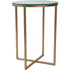 a glass and brass side table with a round top on an isolated white background photo