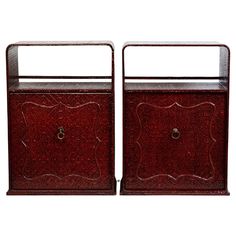 pair of red lacquered nightstands with metal handles