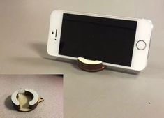 there is a cell phone holder with an apple on it