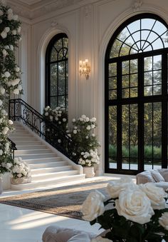 a living room filled with lots of white flowers