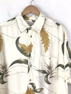 "-Description- >men's cream, yellow, green leaf print hawaiian shirt >collared >button front >button close pocket on the front >size large/XL - tag marked a large but measurements are more like an XL - please check measurements before purchasing >great shirt! >condition: very good >color(s): cream, yellow, green >fabric(s): 100 rayon >brand: preswick & moore >care: machine wash -Measurements- >size: large/XL - tag marked a large but measurements are more l Affordable Green Casual Hawaiian Shirt, Cheap Green Retro Hawaiian Shirt, Yellow Leaf, Green Leaf Print, Resort Shirt, Tan Blazer, Men Cream, Vintage Hawaiian Shirts, Hula Girl