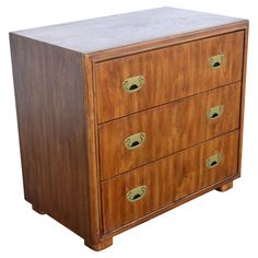 a wooden dresser with three drawers and brass handles