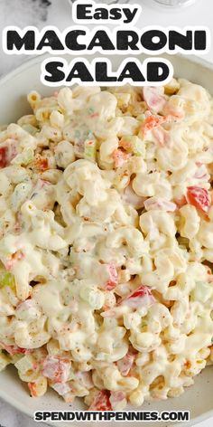 macaroni salad in a white bowl with the words easy macaroni salad