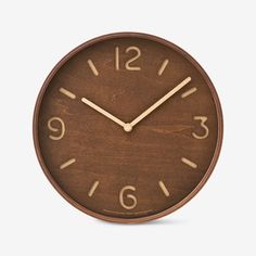 a wooden clock with numbers on the face