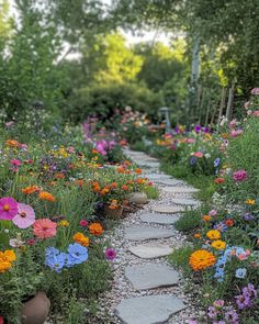 a stone path surrounded by colorful flowers and greenery