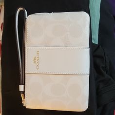 Coach White And Gold Wristlet Nwot Holds Two Cards Also! Everyday White Bag With Wrist Strap, White Wristlet With Zipper Closure, White Clutch With Wrist Strap For Everyday Use, Coach White Rectangular Wallet, White Coach Clutch With Zipper Pouch, White Pouch Wallet With Zipper, White Rectangular Clutch With Zipper Closure, White Wristlet With Removable Pouch, White Pouch Wristlet With Wrist Strap