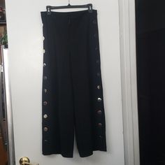 H&M Black Wide Leg Gold Button Snap Crop Pants These Versatile, Fun Pants Are All You Need For The New Party And Holiday Season! Substantial Black Knit With Stretch (5% Elastin), With Wide, Cropped Legs And Smooth, Flat Gold Disks Down Each Leg That Hide Working Snaps (Snaps Open Up To The Hip). Zip Fly With A Button And Hook, Plain Back, No Pockets. Measurements Laid Flat Waist Is Approximately 14 Inches Hips Are Approximately 20 Inches Inseam Is Approximately 25.75 Inches High Rise 11” Leg Ope Black High Waist Wide Leg Pants With Button Closure, Casual Pants With Button Closure For Night Out, Chic Pants With Buttons For Night Out, Wide Leg Bottoms With Snap Buttons For Fall, Black Wide Leg Pants With Button Closure For Fall, Fall Wide Leg Bottoms With Snap Buttons, Black Button-up Pants For Work, Black Button-up Work Pants, Wide Leg Pants With Button Closure For Night Out