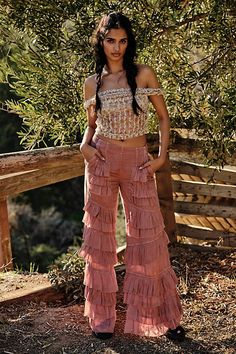 Make a statement for the frill of it in these need-now novelty pants. **Fit:** Mid-rise, billowy tiered design **Features:** Pull-on design, tiered ruffle trimming, raw-edge details, back smocked waistband feature **Why We | Rock And Frill Pants by Free People in Pink, Size: L Frill Pants, Statement Pants, We Rock, Flattering Pants, Trendy Pants, Ruffle Pants, Fun Pants, Eclectic Fashion, Hottest Fashion Trends