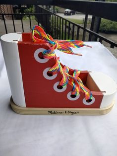 a pair of colorful shoes is sitting on a table