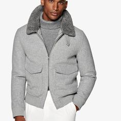 This light grey bomber jacket is tailored to a comfortable regular fit with a hip length and features double end opening zip closure, detachable shearling collar, flapped patch pockets, and ribbed hem and cuffs for a tapered finish. Brown Overcoat, Fitted Coat, Wool Flannel, Vest Coat, Half Zip Sweaters, Field Jacket, Zip Sweater, Hip Length, Black Tie