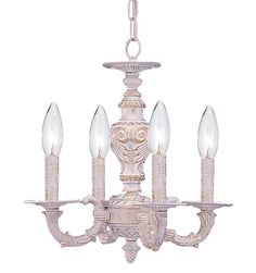 a chandelier with four lights hanging from it's sides and two candles in the middle