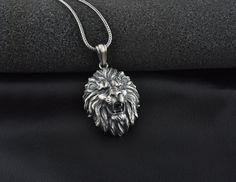 Silver Lion Head Mens Necklace, The details of this necklace and chain are made with fine handcrafted. This pendant and chain are 925 sterling silver and oxidized plated. ★Item Details * Material : 925 Sterling Silver * Pendant Diameter : 3,3cm x 2,60cm (1.30 x 1.05 inc) + 1.00cm (0.40 inc ) Bail * Bail With : Suitable for up to 3.00 mm Chain * Chain Thickness : 0.15 cm -( 0.06 inches ) * Pendant Weight : 17-19 Grams * Chain Weight : 18 Inches - (45cm) = 4.50 Gr 20 Inches - (50cm) = 5.10 Gr 22 I Silver Engraved Custom Necklace For Formal Occasions, Formal Silver Engraved Custom Necklace, Formal Engraved Silver Custom Necklace, Luxury Silver Necklace With Engraving Option, Luxury Sterling Silver Necklace With Engraving Option, Formal Sterling Silver Necklace With Engraving Option, Angry Lion, Lion Head Necklace, Wild Lion