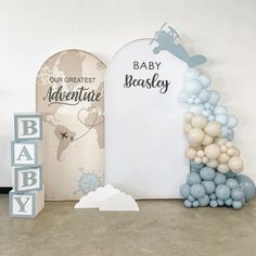 a baby shower with balloons and decorations on the floor